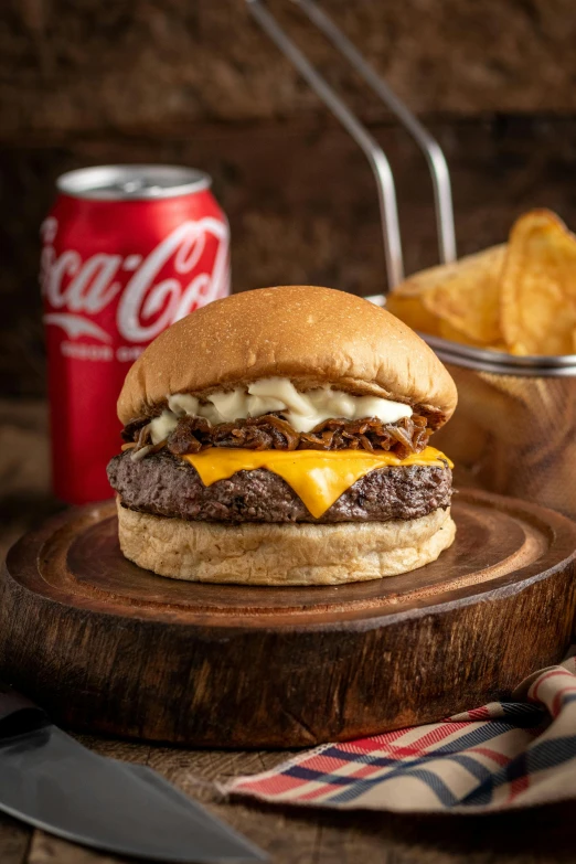 there is a sandwich on a  board with fries