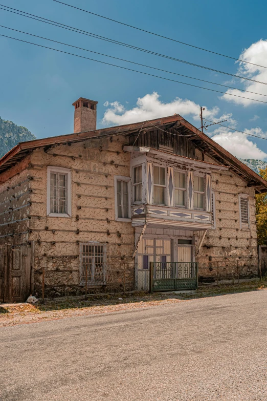 an old brick building on a street corner