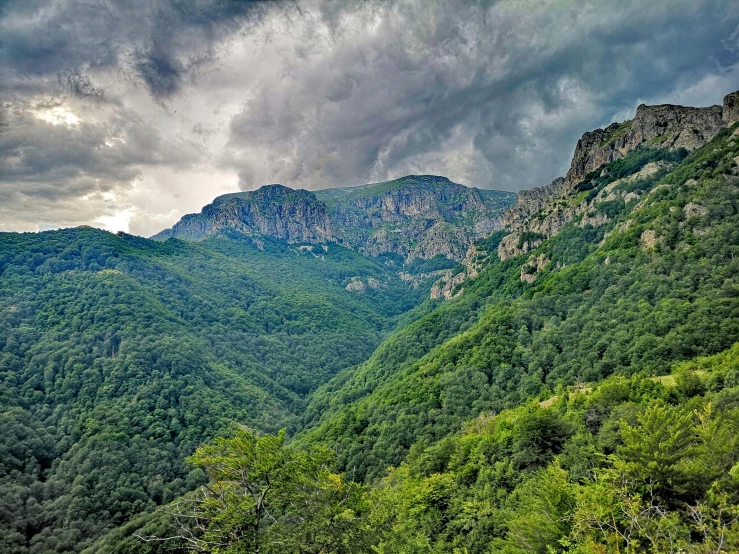 large mountain range with green mountains in background