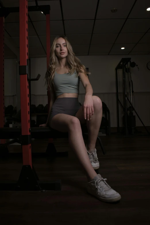 a beautiful woman posing in a gym