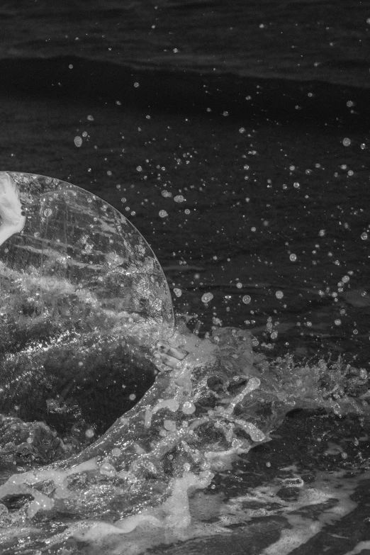 a man in the water on his board riding on a wave