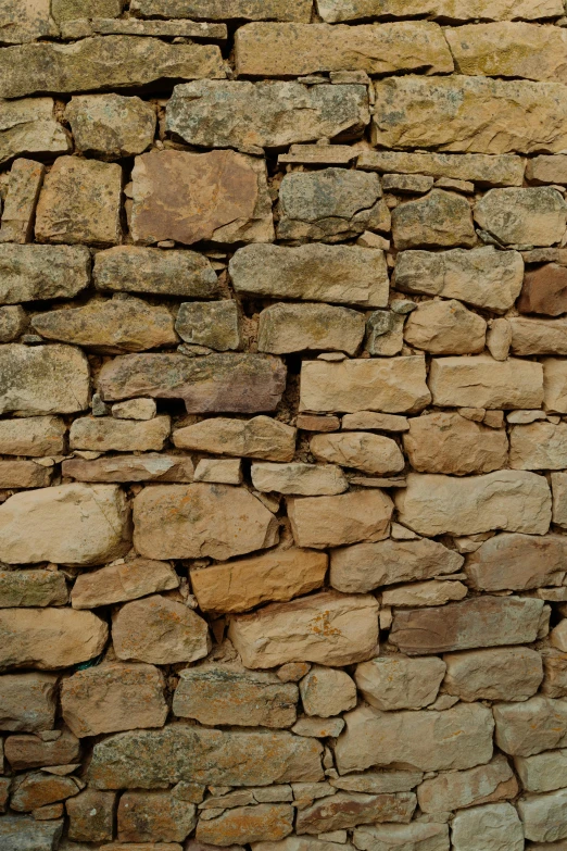 there is a stone wall built with rocks