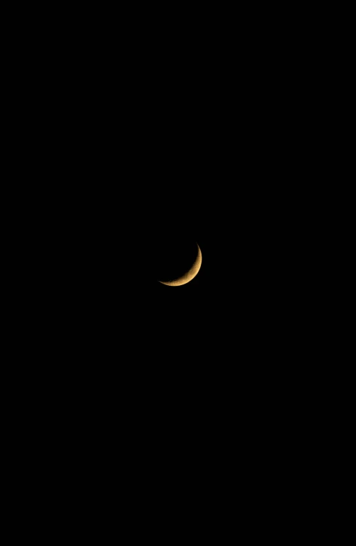 the moon seen through the night sky