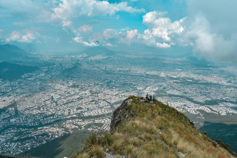 a view of a city as seen from the top of a hill