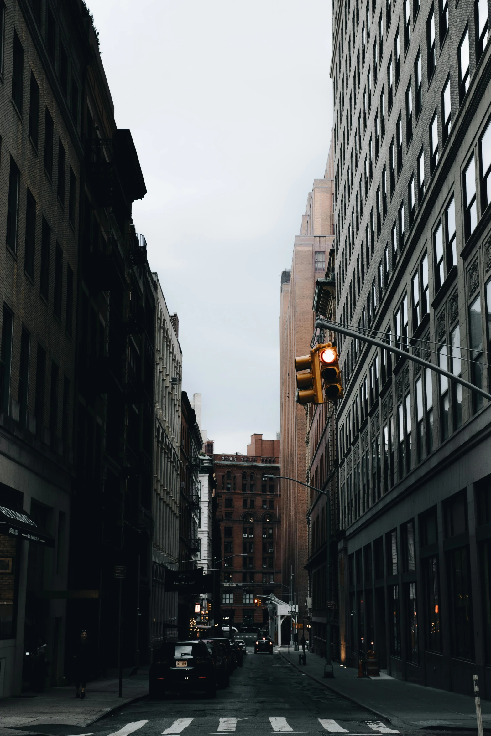 an old fashioned street light in the middle of the road