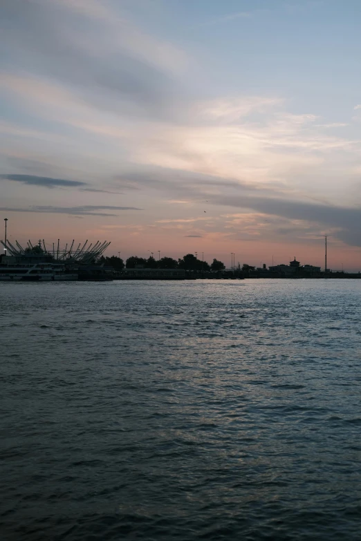 a sail boat floating on top of a large body of water