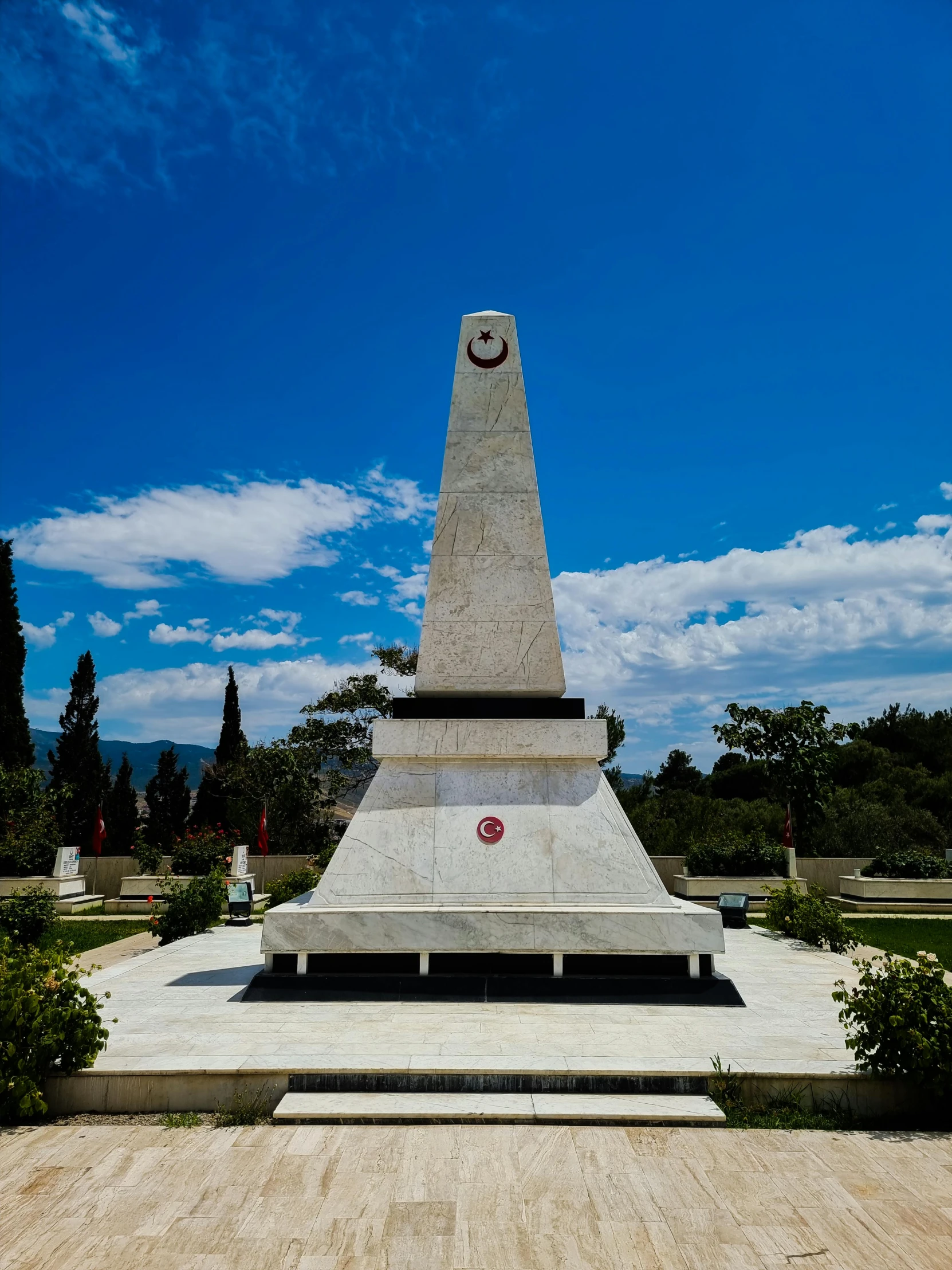 a monument near a park on a sunny day