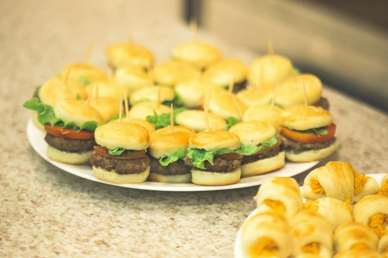 small sandwiches with cheese and vegetables on plates