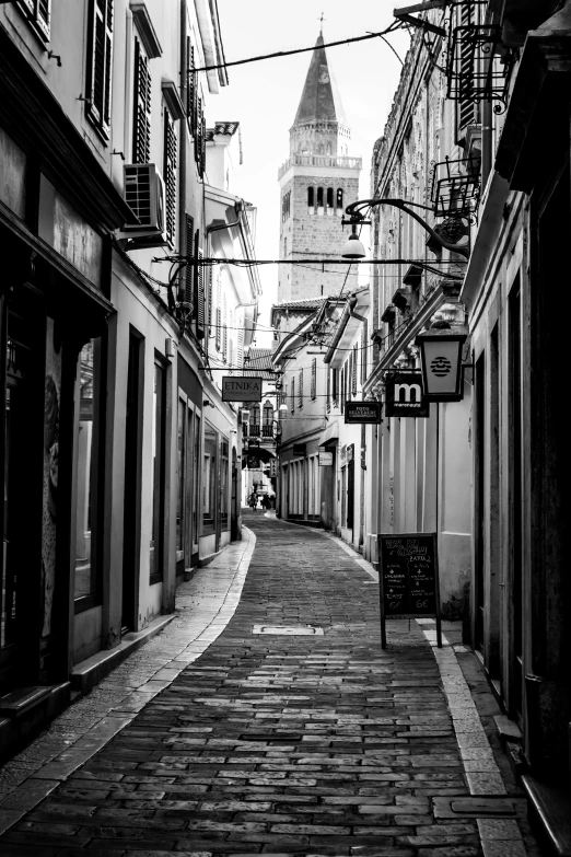 an old alley with a sign that says old city