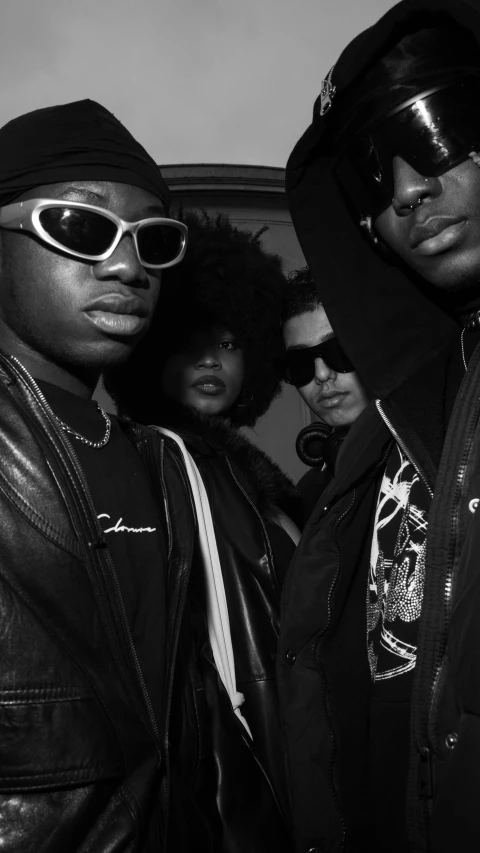 four black men with hoods and sunglasses
