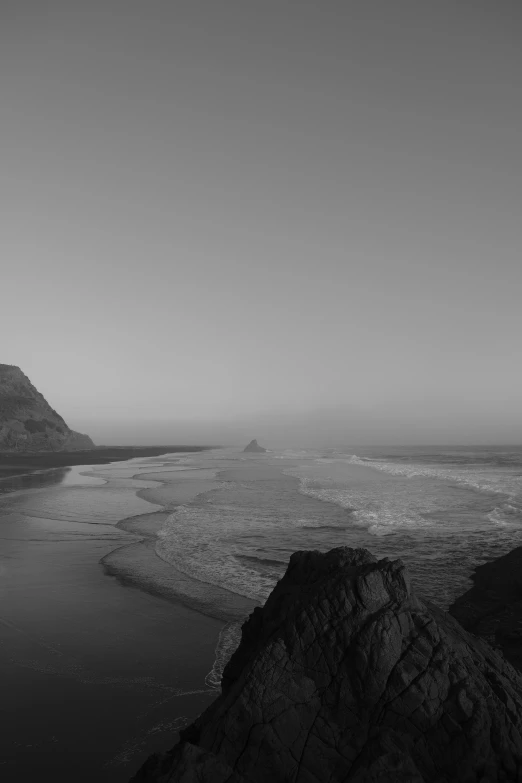 a large body of water with small waves