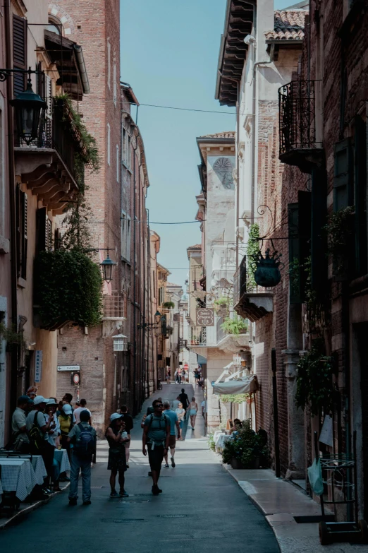 some people are walking down a city street