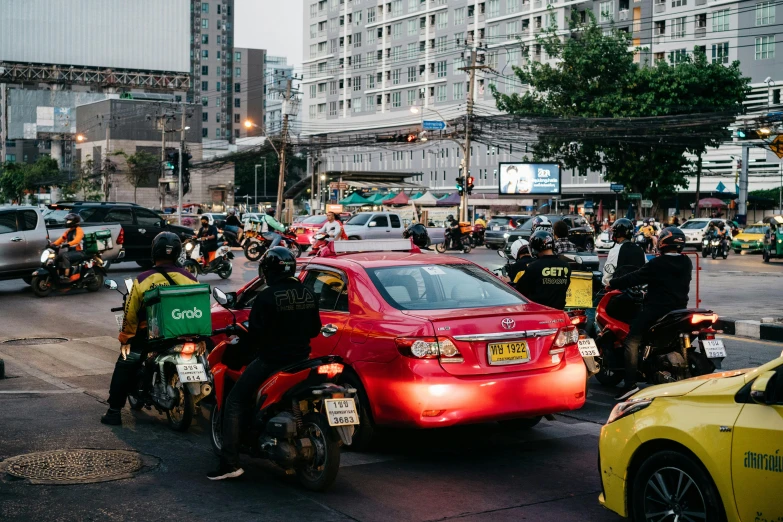 several cops riding motorcycles in the middle of a city street