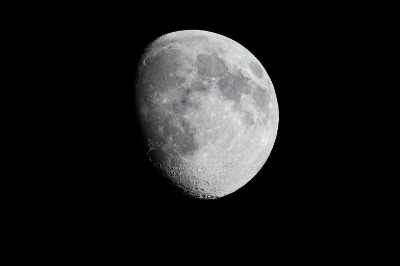 the moon is dark as seen in the sky