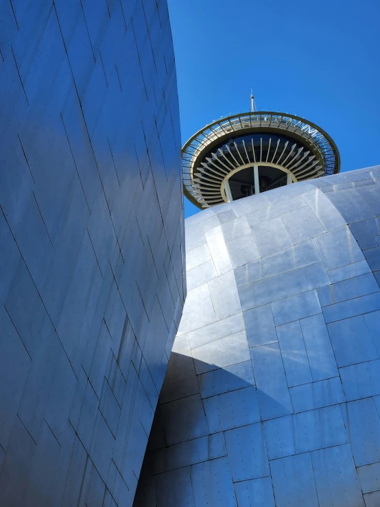 an architectural structure stands against a blue sky