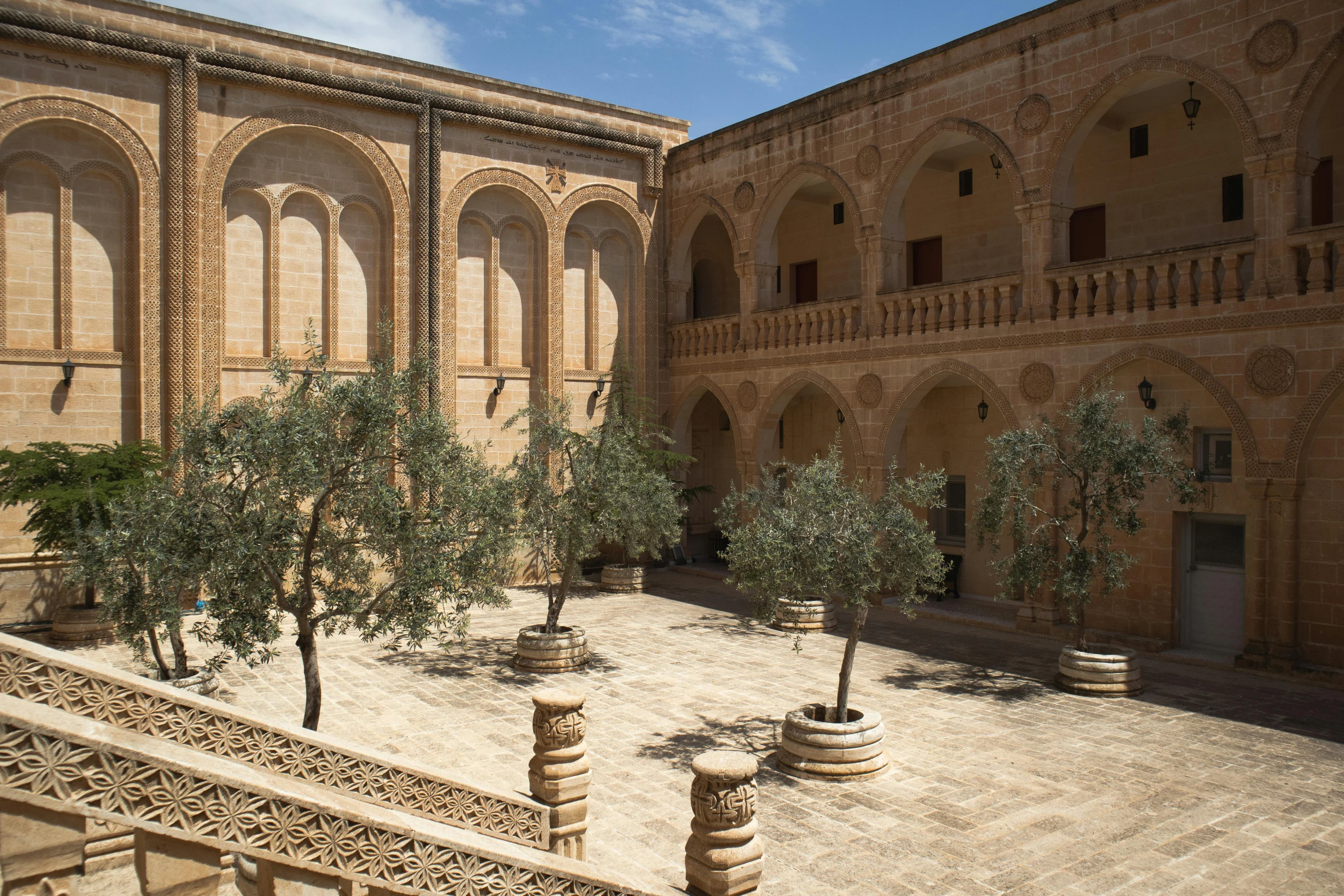 courtyard area with trees, stairs and seating areas