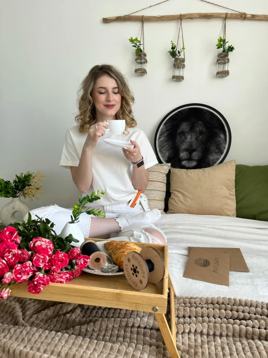 a woman is drinking and looking over her food