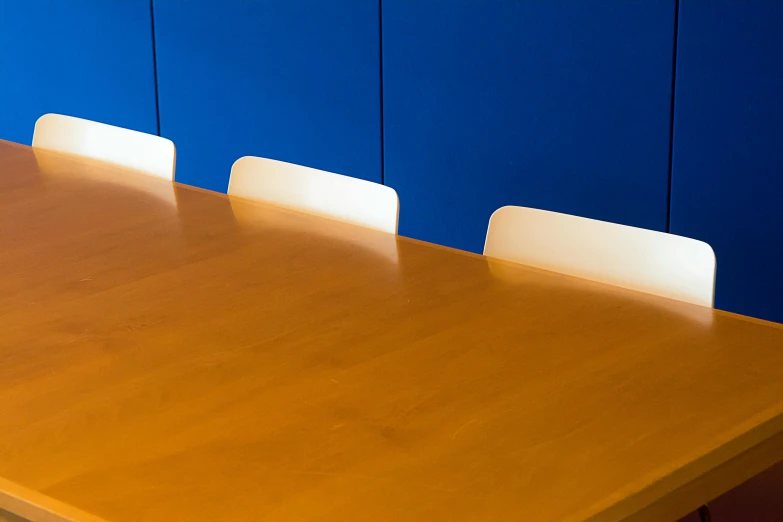 a dining table and chairs in an office setting