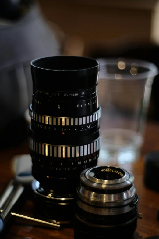 many different types of cameras stacked on top of each other