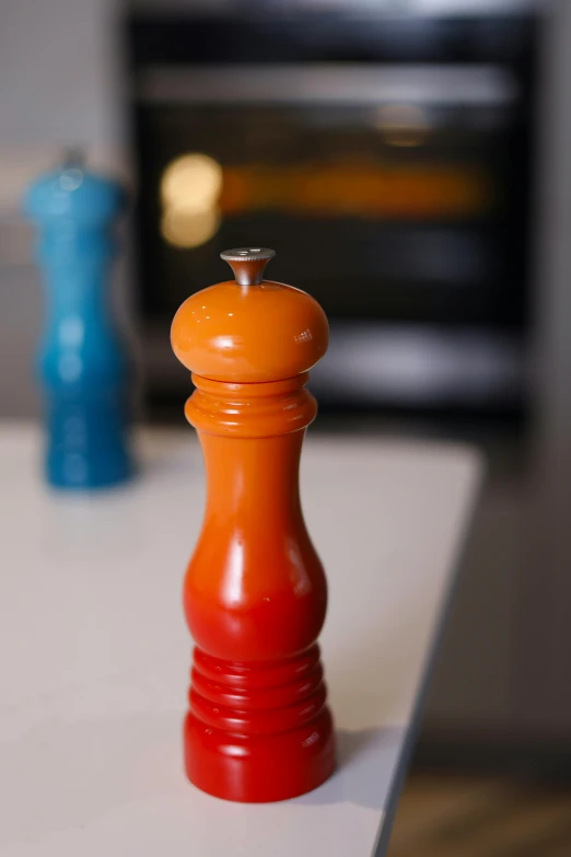 a red pawn shaped cookie cutter sitting on a counter