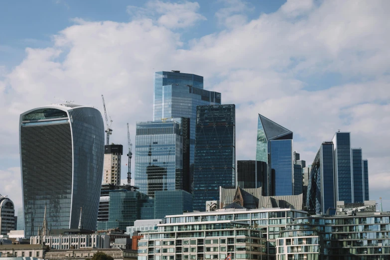 a skyline of skyscrs are shown with boats in the water