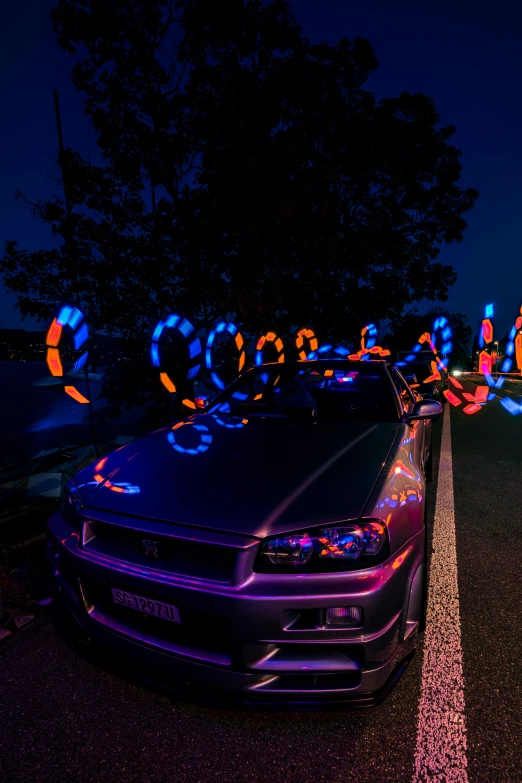 some bright lights shine on the hood of a car