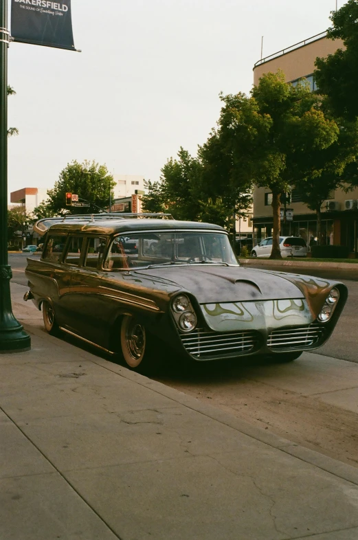 a vintage car parked on the side of the road