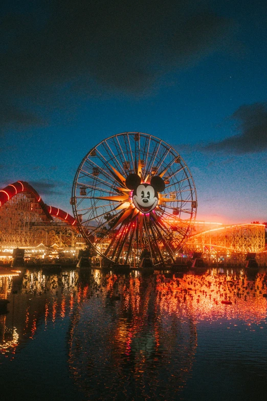 a ferris wheel with a lot of lights at night time