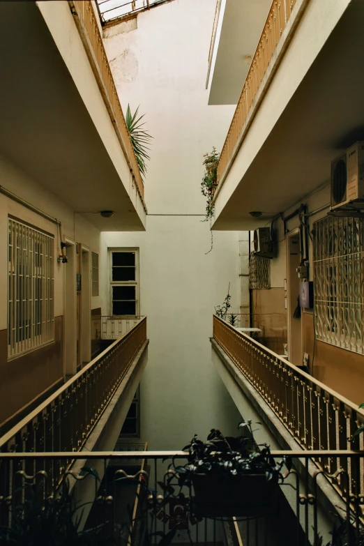 an enclosed walkway leads to the second floor of an apartment building