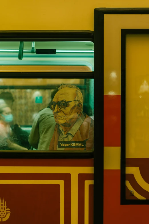 people standing inside of a bus looking out the window