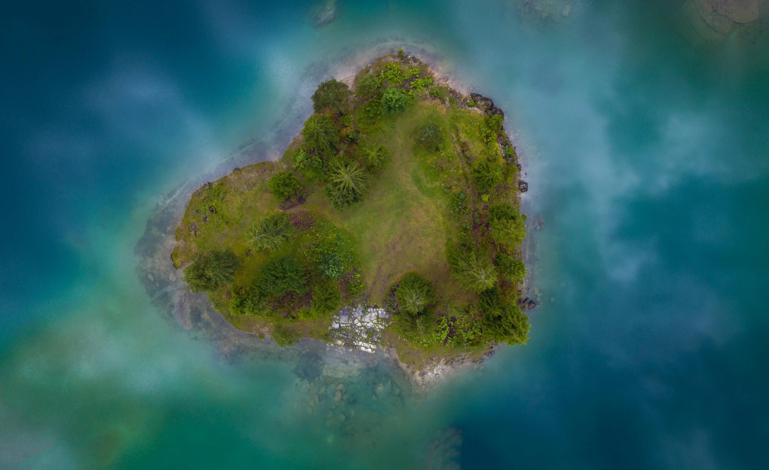 an island in the water with two small islands