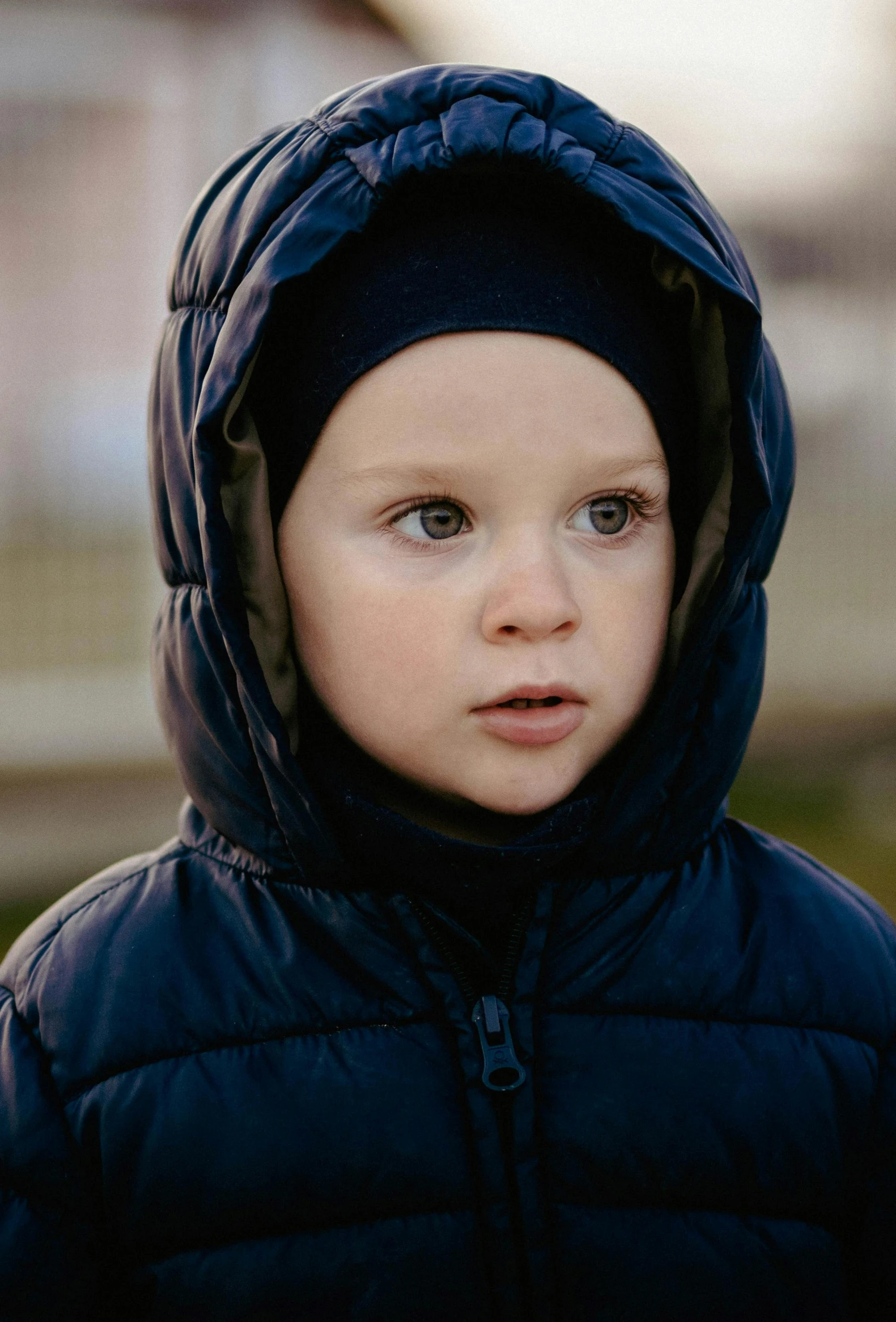 a little boy that is looking at the camera