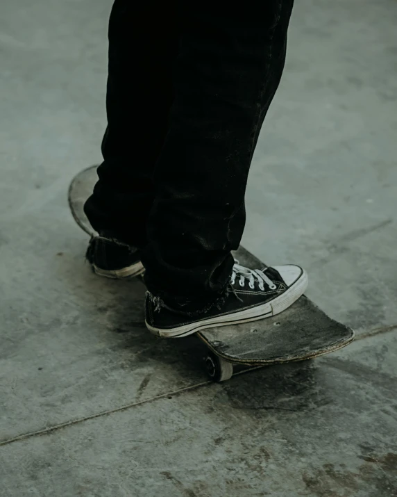 a close up of the toe of a persons feet on a skateboard