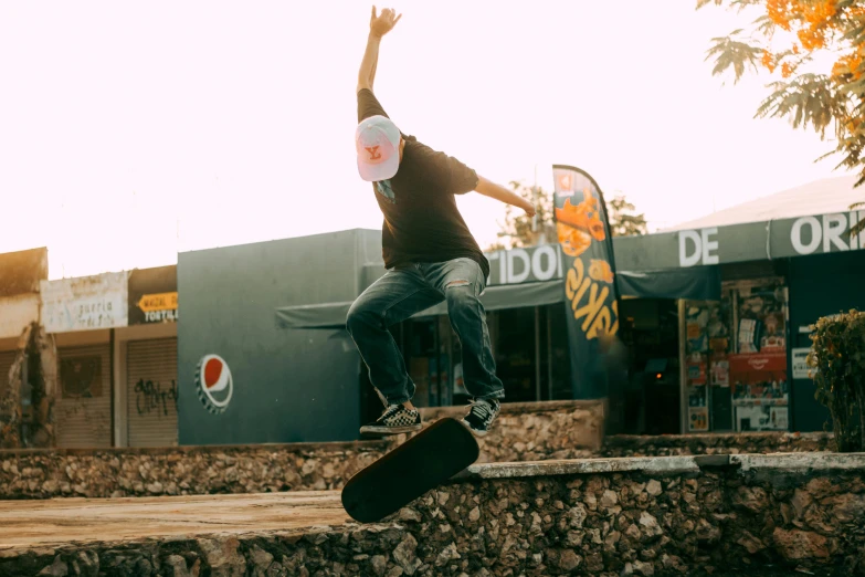 the man is performing a trick on his skateboard