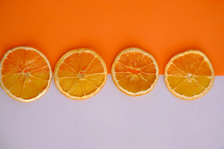 an orange is shown with 4 slices cut in half