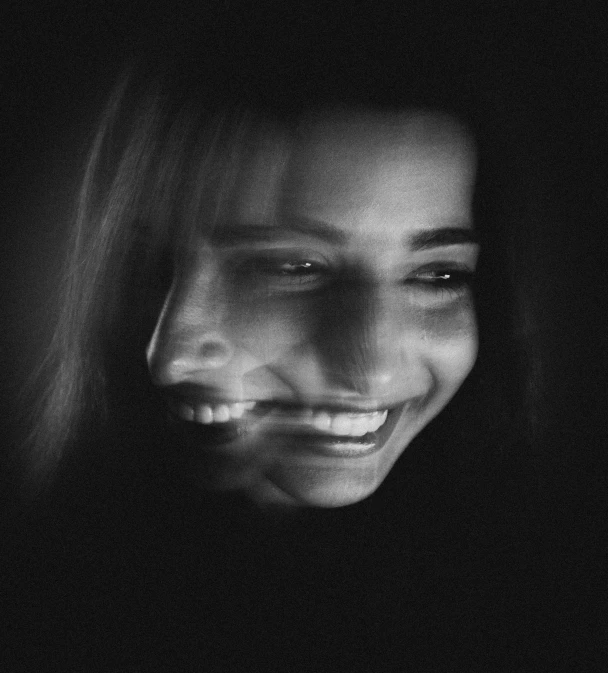 black and white pograph of a smiling woman