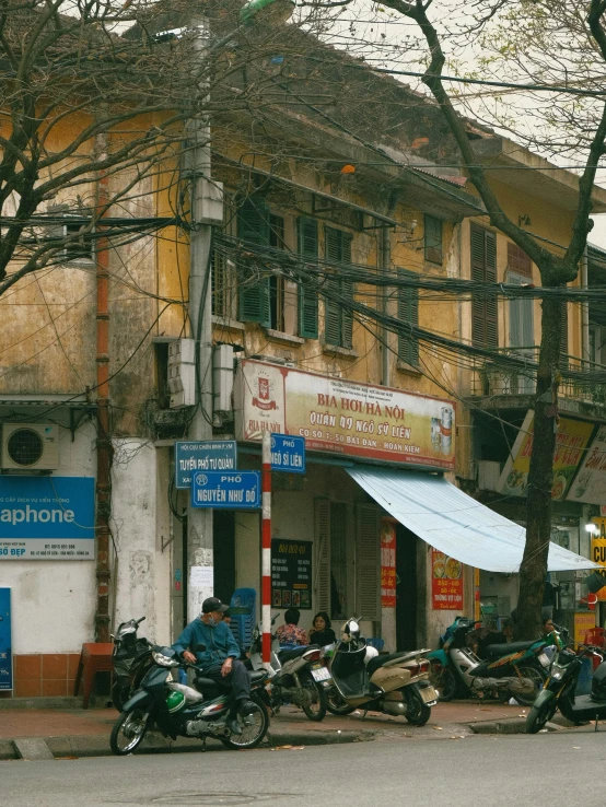 a number of motorcycles parked next to each other in front of a building