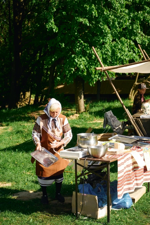 woman preparing to eat a meal in the open air