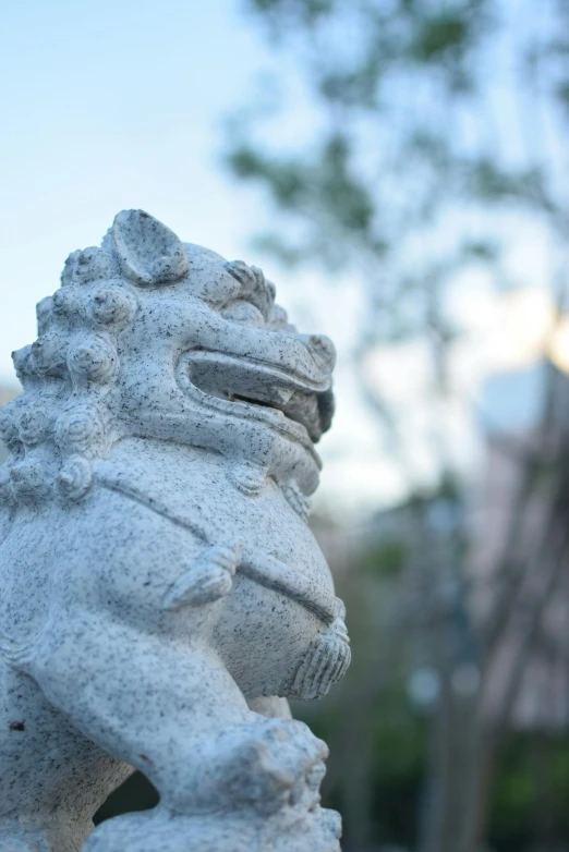 there is a stone statue with a lion face on it