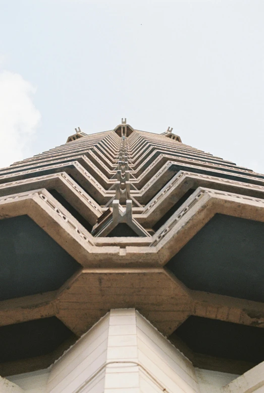 a very close up view of an unusual building's roof