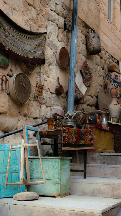 an assortment of items hanging on the side of a building