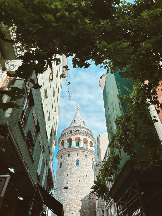 view of tower from bottom down the street