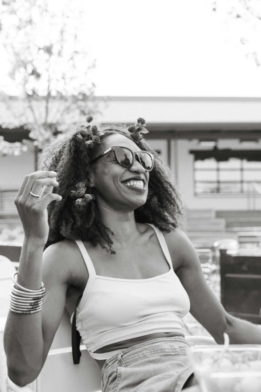 a woman smiles in front of a truck