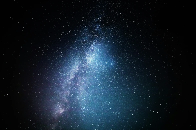 a bright star field against black sky with stars