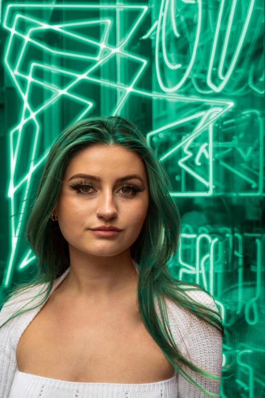 a woman with green hair and an electric light behind her