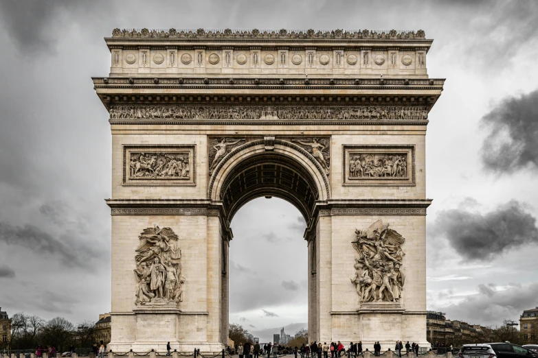 a very large gate with statues at the top