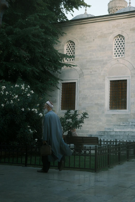 a man walking with a suitcase behind his