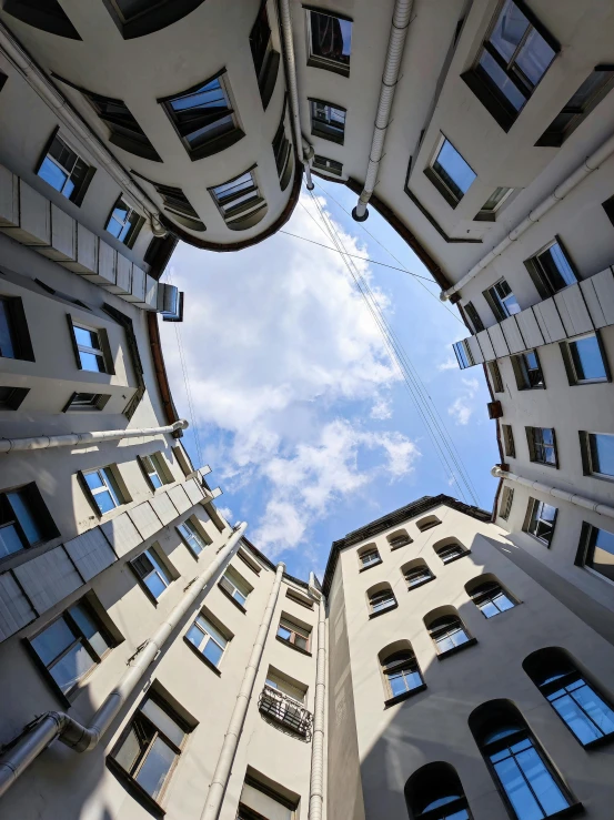 looking up at tall buildings from the ground