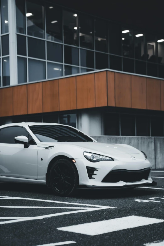 the white toyota 868gtd sports car parked on a parking lot