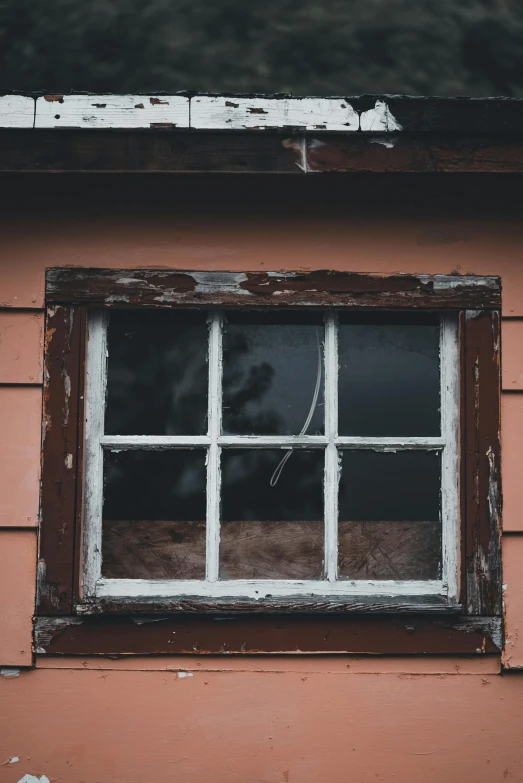 a picture of a window on a brick wall